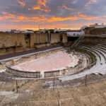 La Consejería de Cultura trabaja en la reconstrucción del frente escénico del Teatro Romano de Itálica